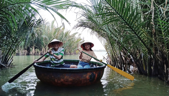Couple is paddling basket boat by themselves