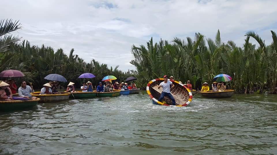 The man make a special performance on coconut boat